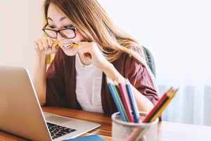 Unsplash Photo | Woman Biting Pencil